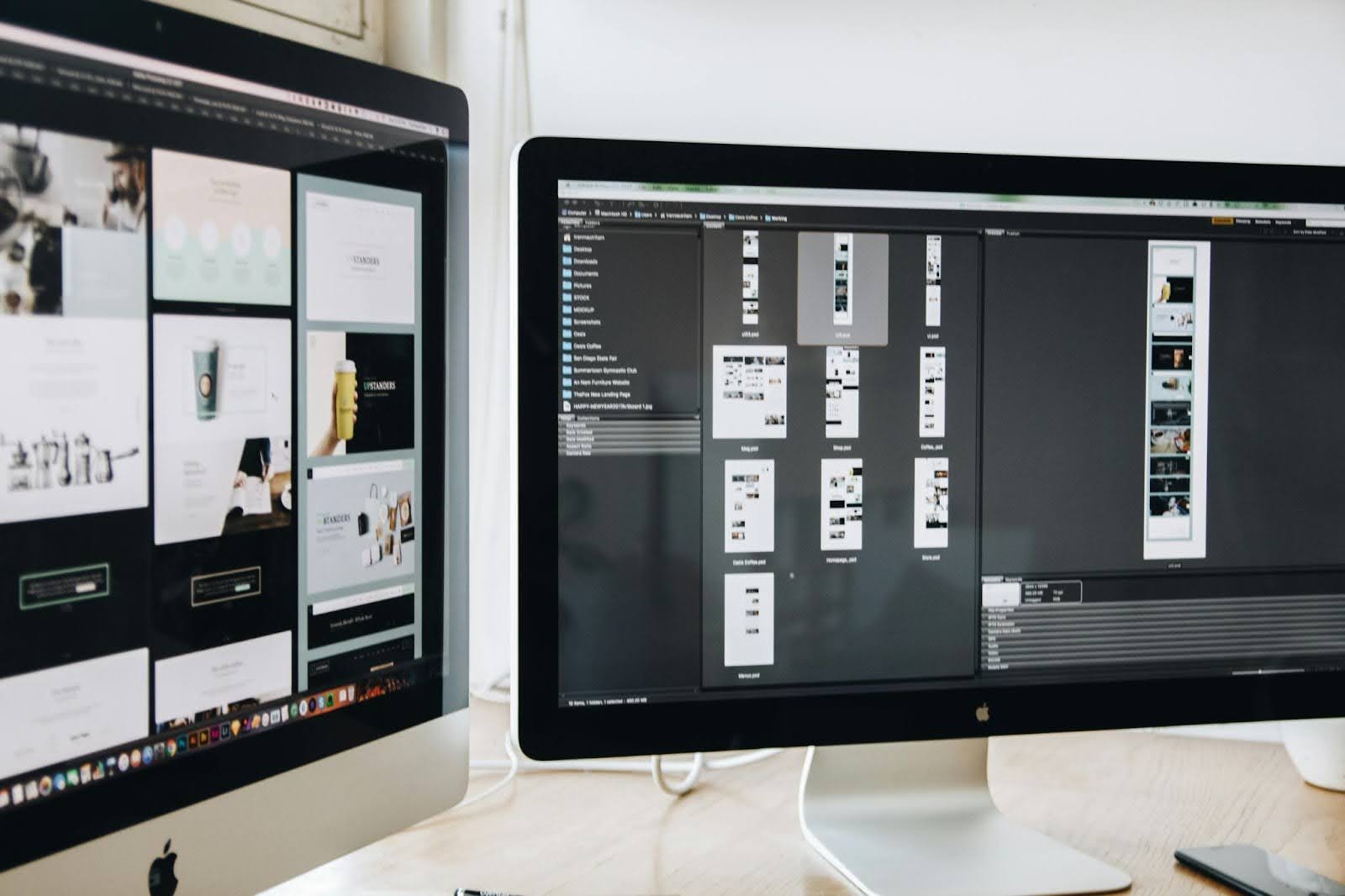 Two Apple monitors placed next to each other